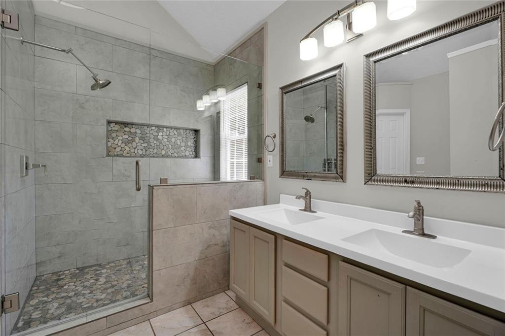 281 Cedars Glen Circle Villa Rica, GA 30180 - Photo 21 of 52 a bathroom with a sink and a mirror