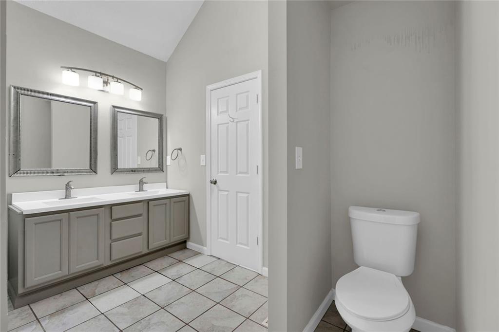 281 Cedars Glen Circle Villa Rica, GA 30180 - Photo 22 of 52 a bathroom with a toilet sink and mirror