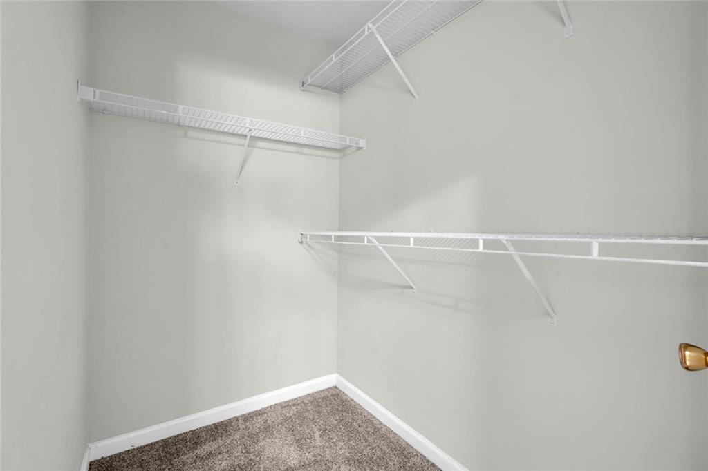 281 Cedars Glen Circle Villa Rica, GA 30180 - Photo 23 of 52 a view of a room with racks on the wall