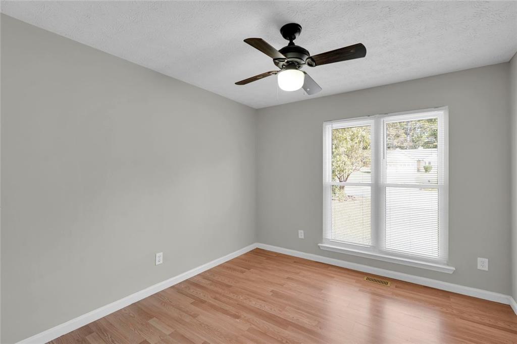 281 Cedars Glen Circle Villa Rica, GA 30180 - Photo 31 of 52 a view of empty room with wooden floor and fan