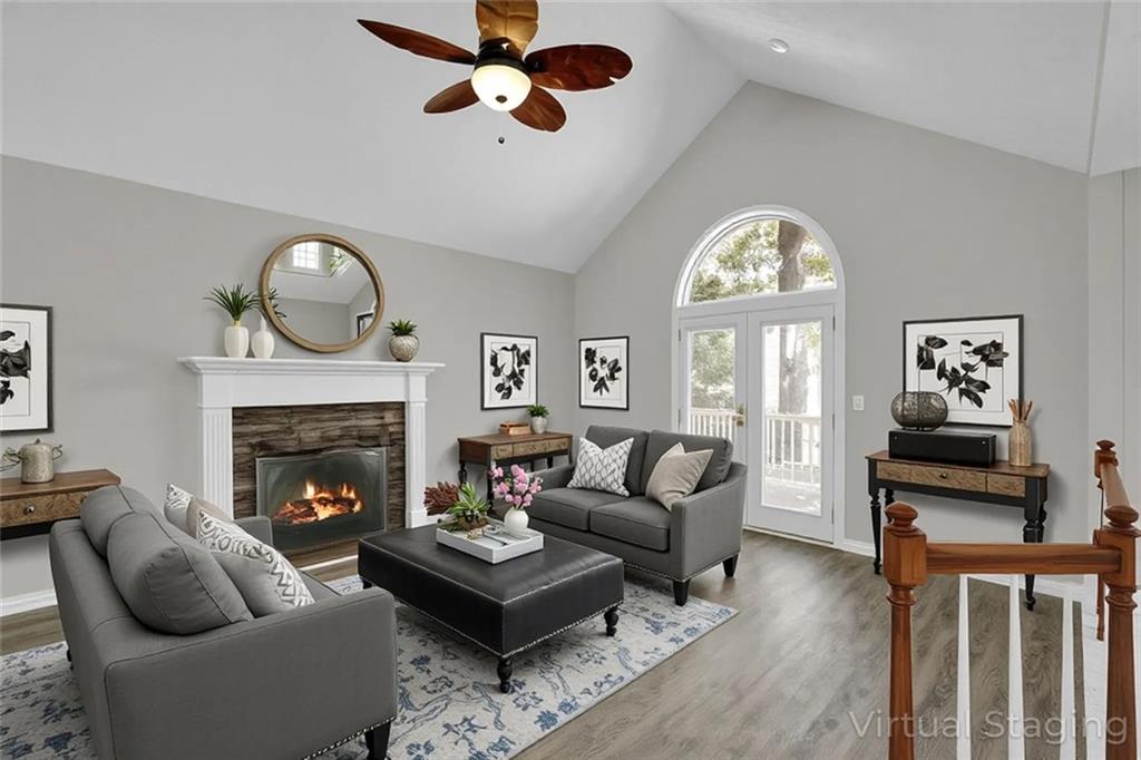 281 Cedars Glen Circle Villa Rica, GA 30180 - Photo 4 of 52 a living room with furniture a fireplace and a flat screen tv