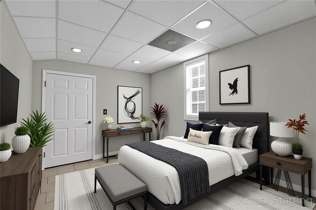 281 Cedars Glen Circle Villa Rica, GA 30180 - Photo 41 of 52 a bedroom with a bed and a potted plant