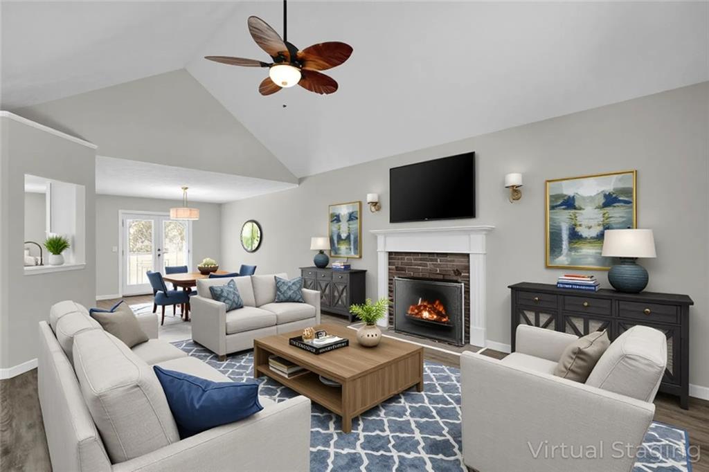 281 Cedars Glen Circle Villa Rica, GA 30180 - Photo 6 of 52 a living room with furniture a fireplace and a flat screen tv