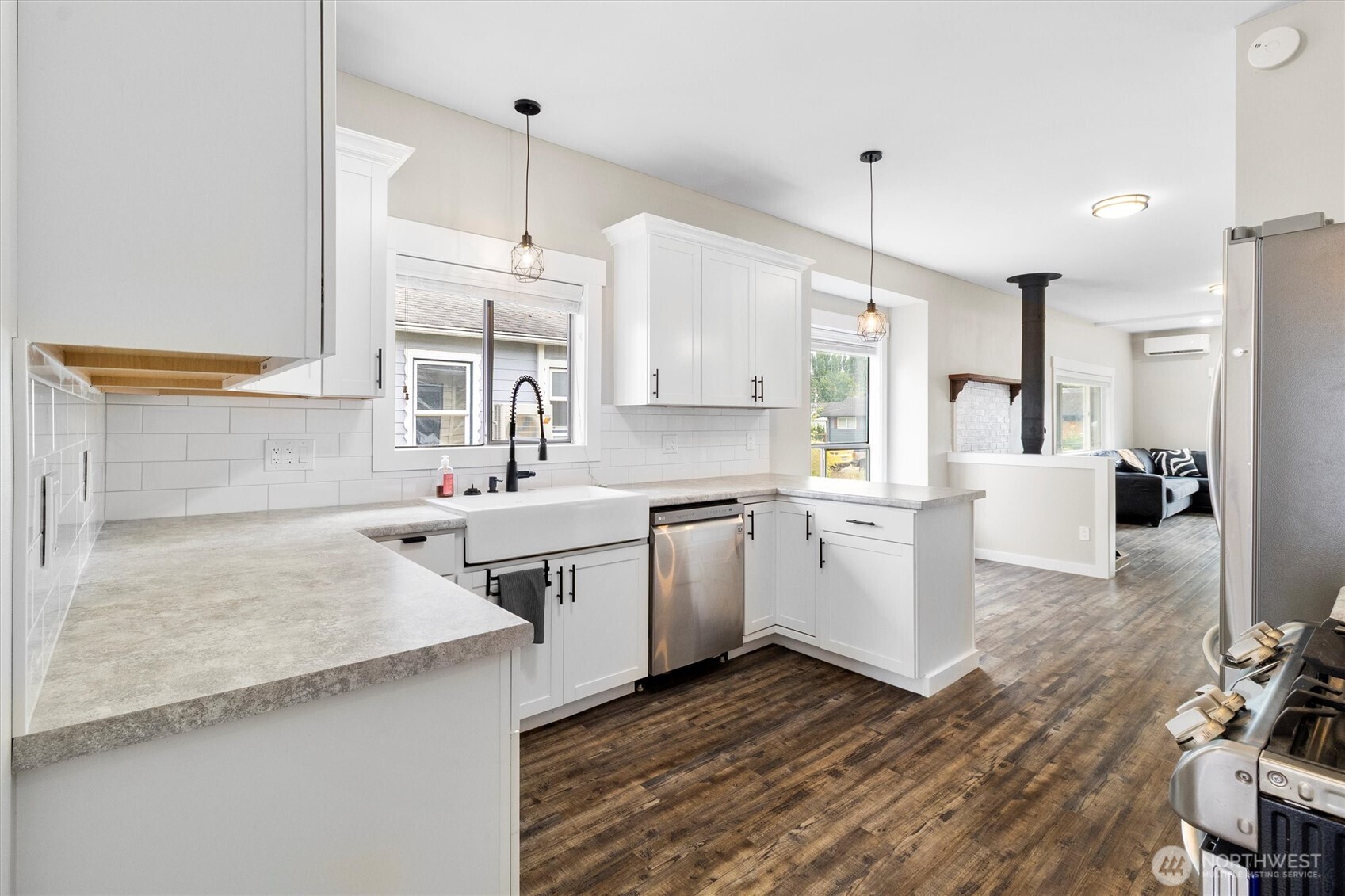 310 Second Street Sumas, WA 98295 - Photo 11 of 28 a kitchen with a sink stove and cabinets