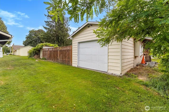a view of a backyard with a small cabin