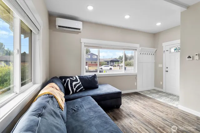 a living room with a couch and a large window