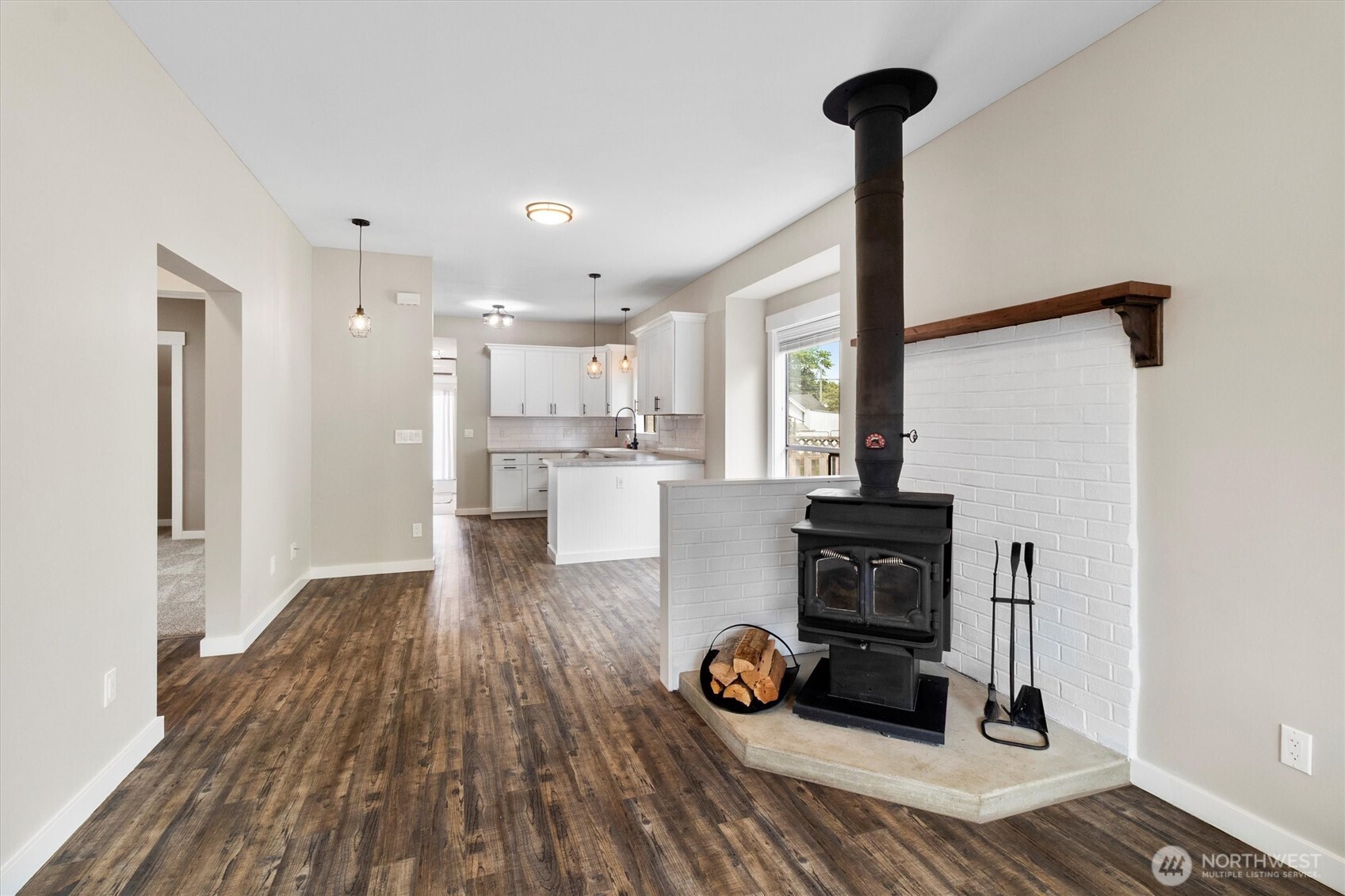 310 Second Street Sumas, WA 98295 - Photo 6 of 28 a view of a kitchen with kitchen island wooden floors appliances and cabinets