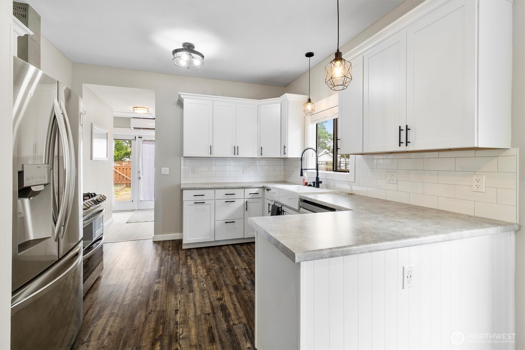 310 Second Street Sumas, WA 98295 - Photo 10 of 28 a kitchen with a sink stove and refrigerator