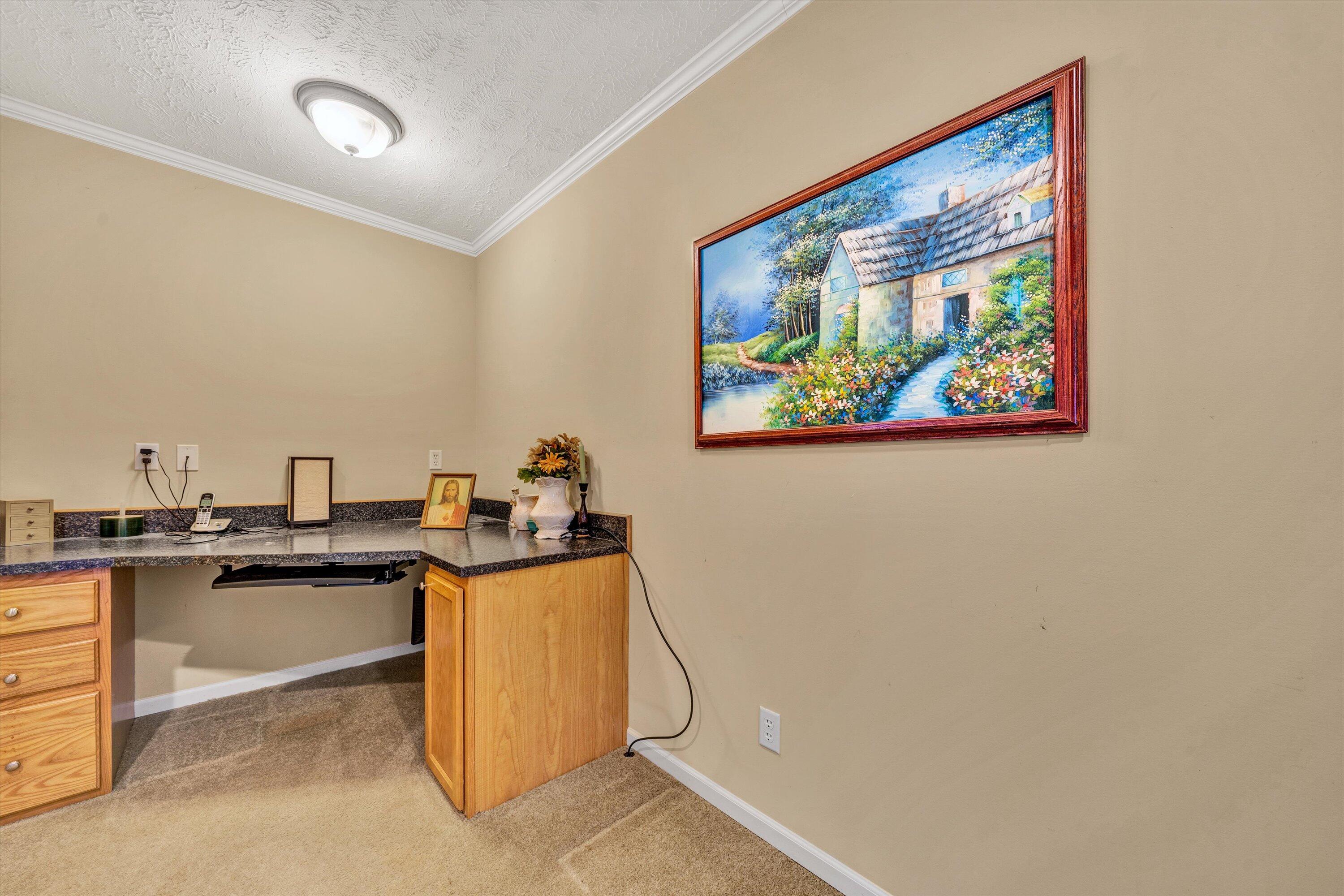 590 Belcher Road Penhook, VA 24137 - Photo 11 of 23 a view of a workspace with furniture and window