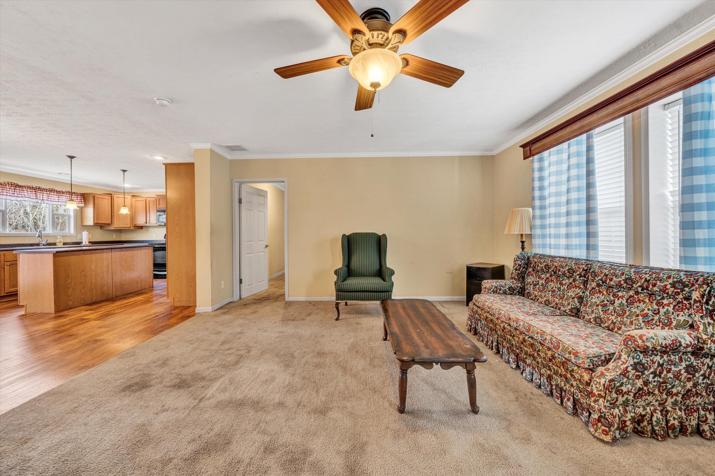 590 Belcher Road Penhook, VA 24137 - Photo 5 of 23 a living room with furniture and a large window