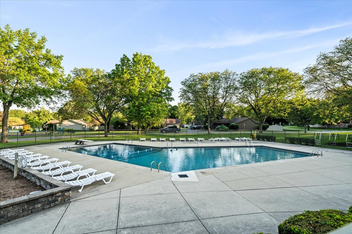 768 High Ridge Road Roselle, IL 60172 - Photo 45 of 46 a view of swimming pool with outdoor space and lake view in back