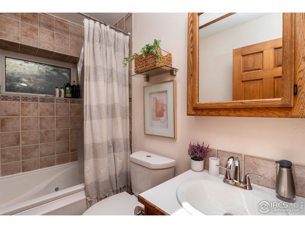 162 Alaska Road Boulder, CO 80302 - Photo 20 of 31 a bathroom with a toilet sink and mirror