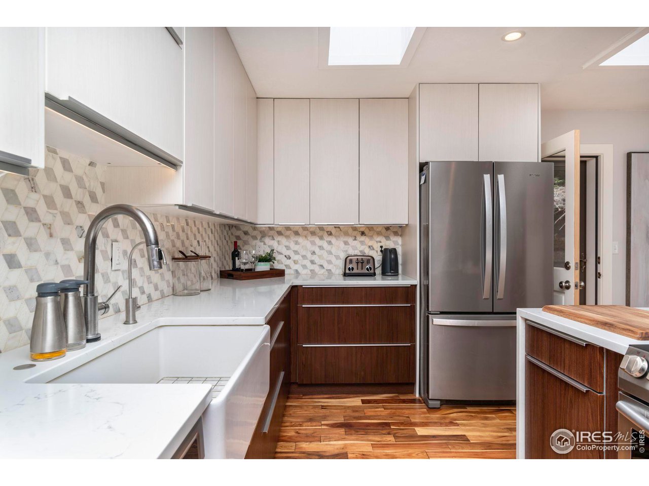 162 Alaska Road Boulder, CO 80302 - Photo 2 of 31 a kitchen with granite countertop a refrigerator and a sink
