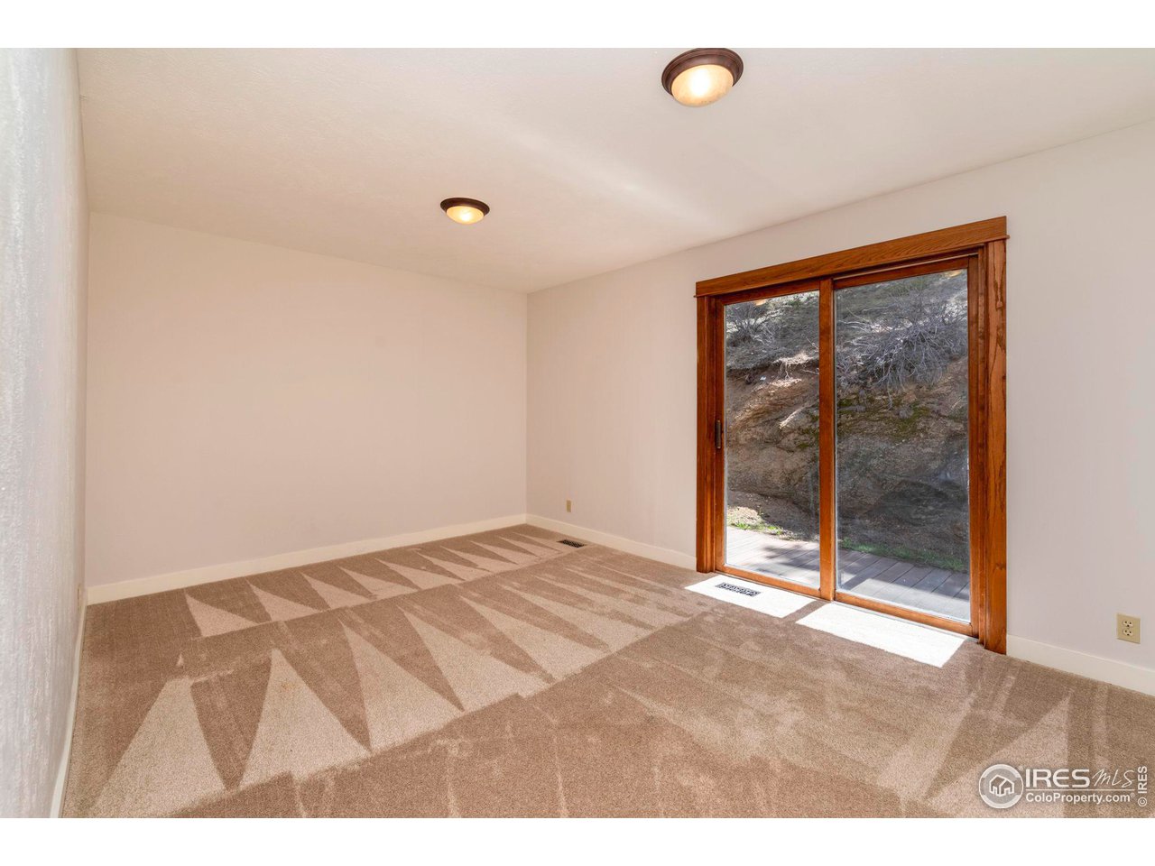 162 Alaska Road Boulder, CO 80302 - Photo 21 of 31 a view of an empty room and window