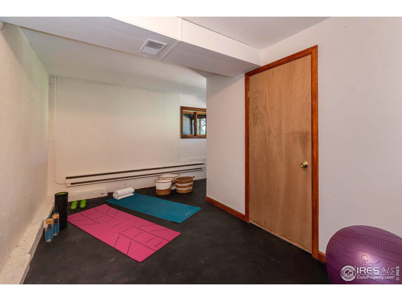 162 Alaska Road Boulder, CO 80302 - Photo 27 of 31 a view of a room with a bench and wooden floor