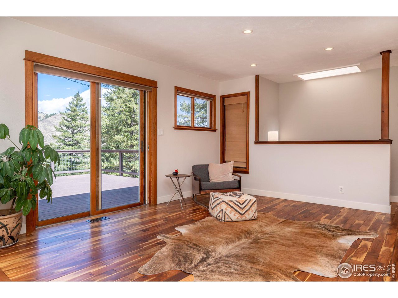 162 Alaska Road Boulder, CO 80302 - Photo 8 of 31 a view of livingroom with furniture window and wooden floor