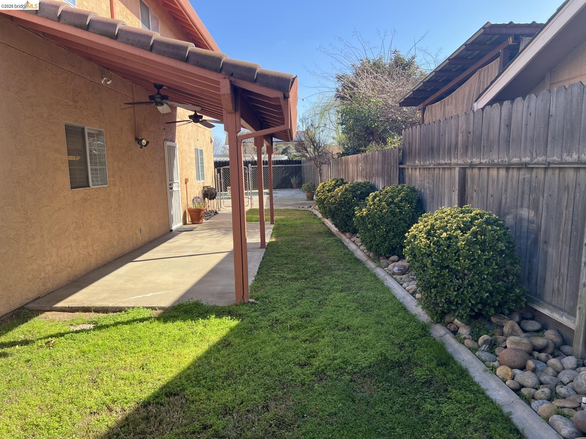 3816 Teek Court Ceres, CA 95307 - Photo 15 of 21 a view of a backyard with plants