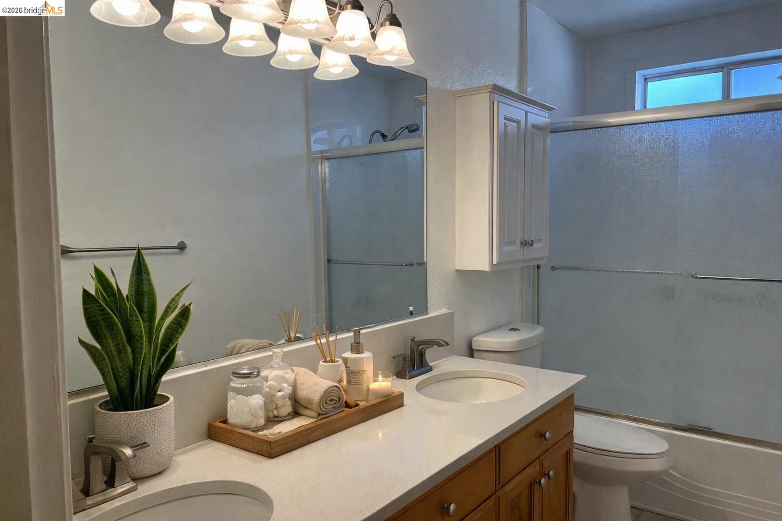 3816 Teek Court Ceres, CA 95307 - Photo 9 of 21 a bathroom with a granite countertop sink a toilet and a mirror