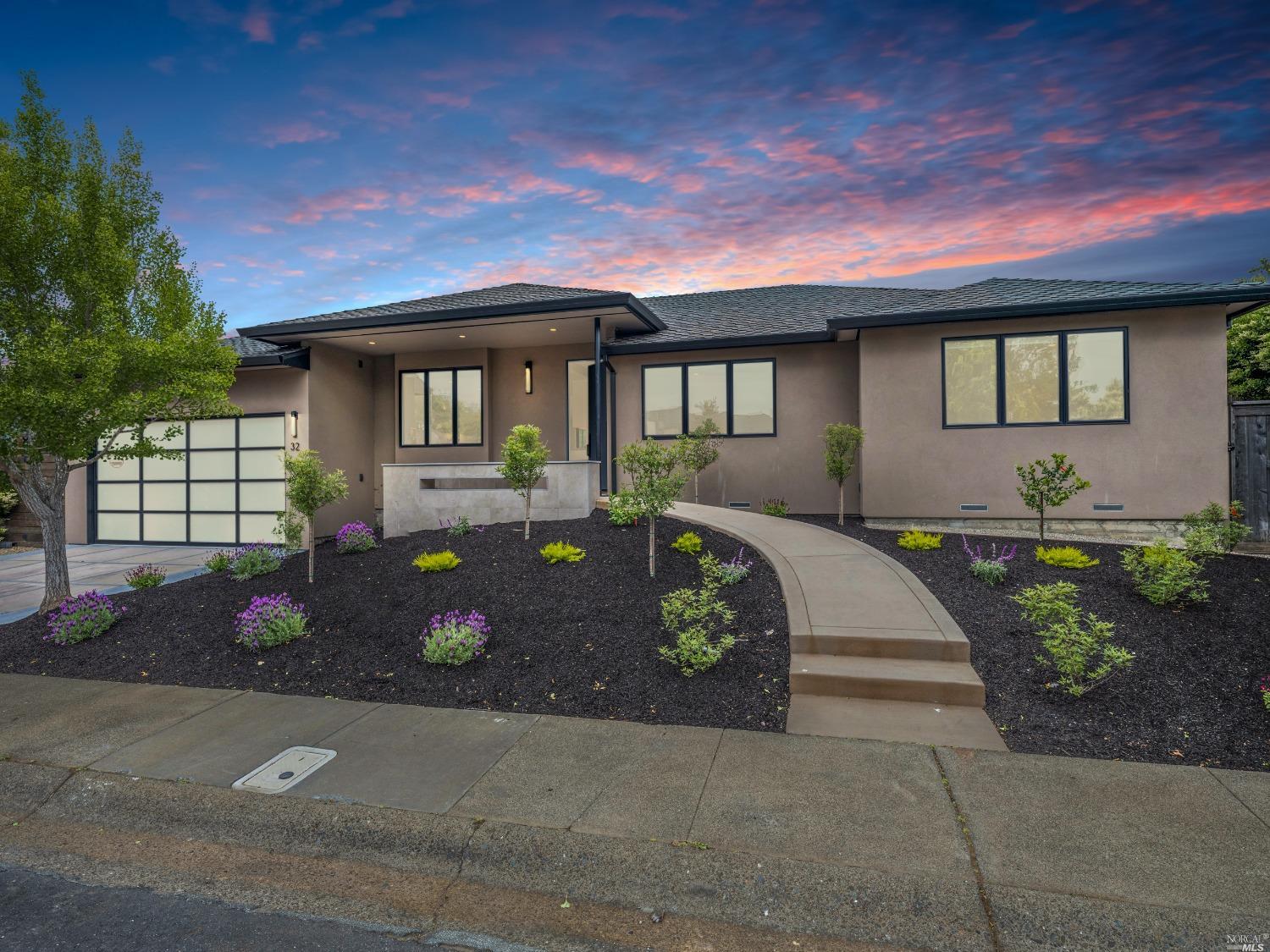 a front view of a house with garden