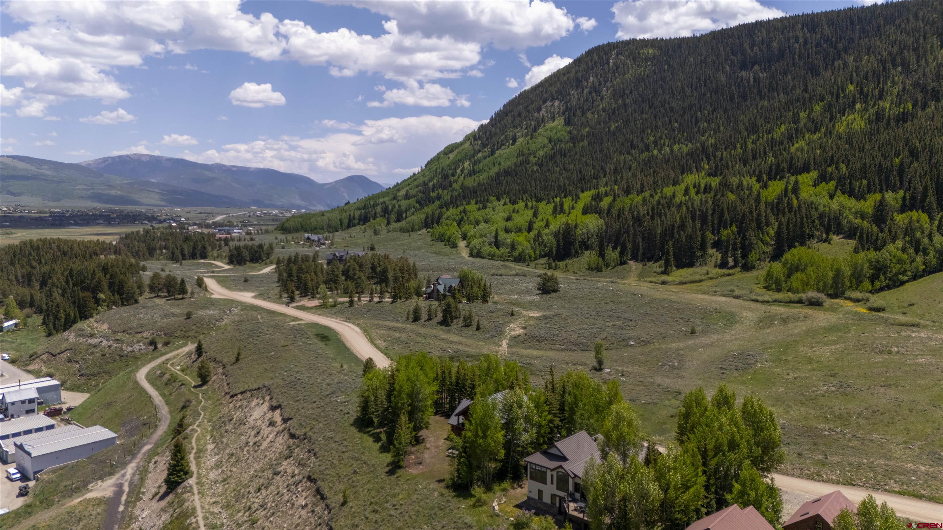 398 Journey's End Road Crested Butte, CO 81224 - Photo 17 of 42 a view of a town with mountains in the background