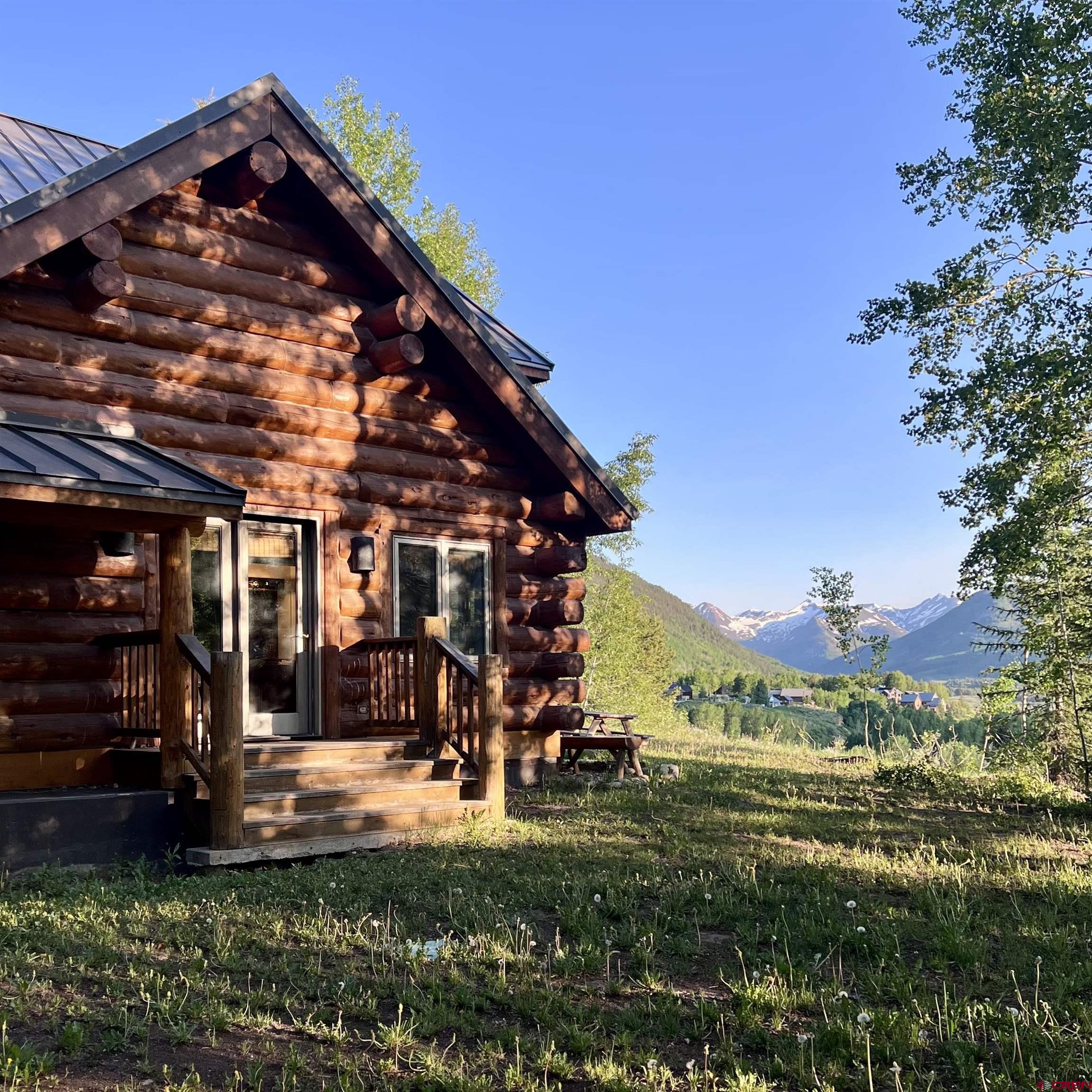 398 Journey's End Road Crested Butte, CO 81224 - Photo 19 of 42 a view of a house with a yard