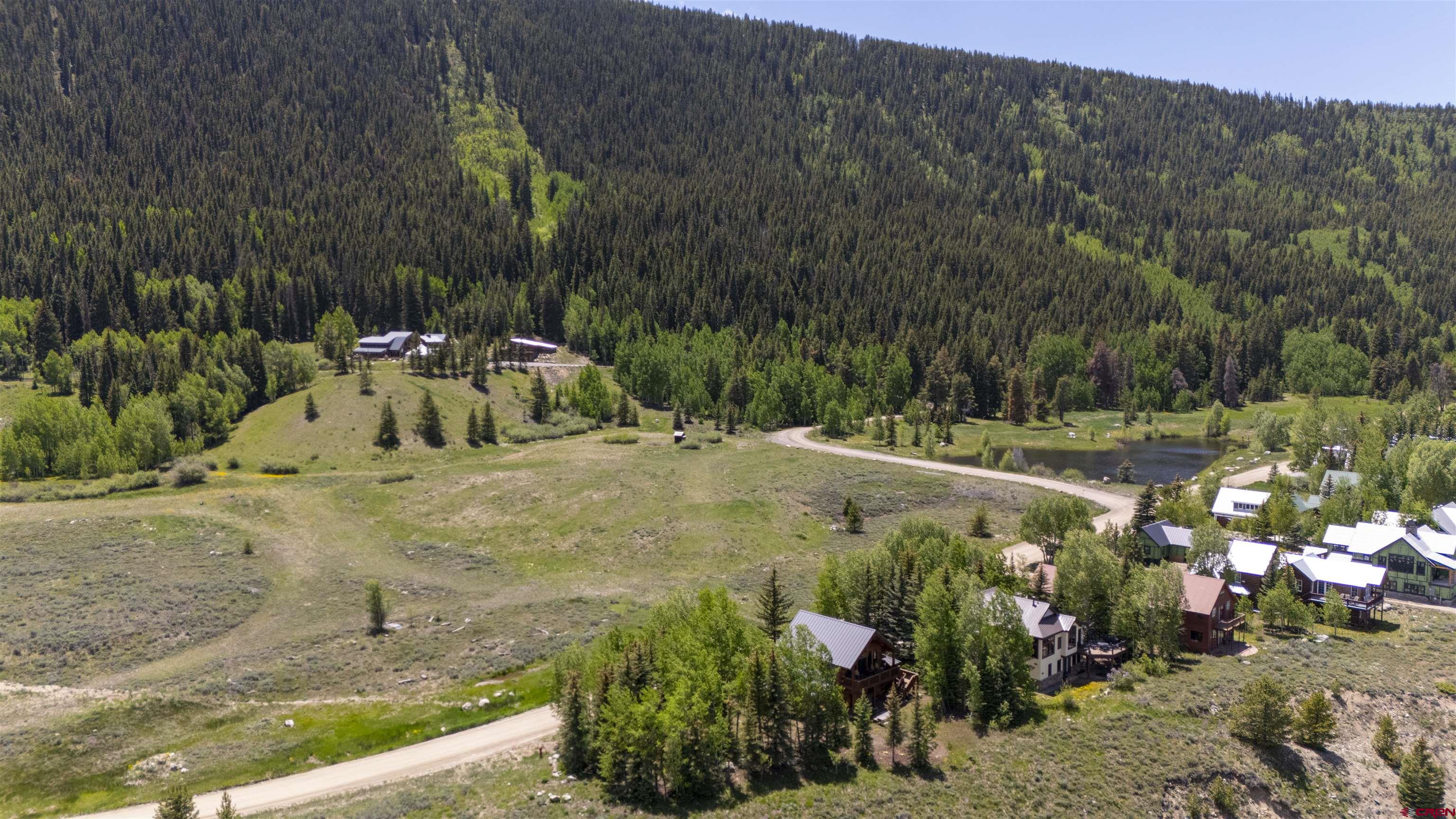 398 Journey's End Road Crested Butte, CO 81224 - Photo 2 of 42 a view of swimming pool with a yard and seating area