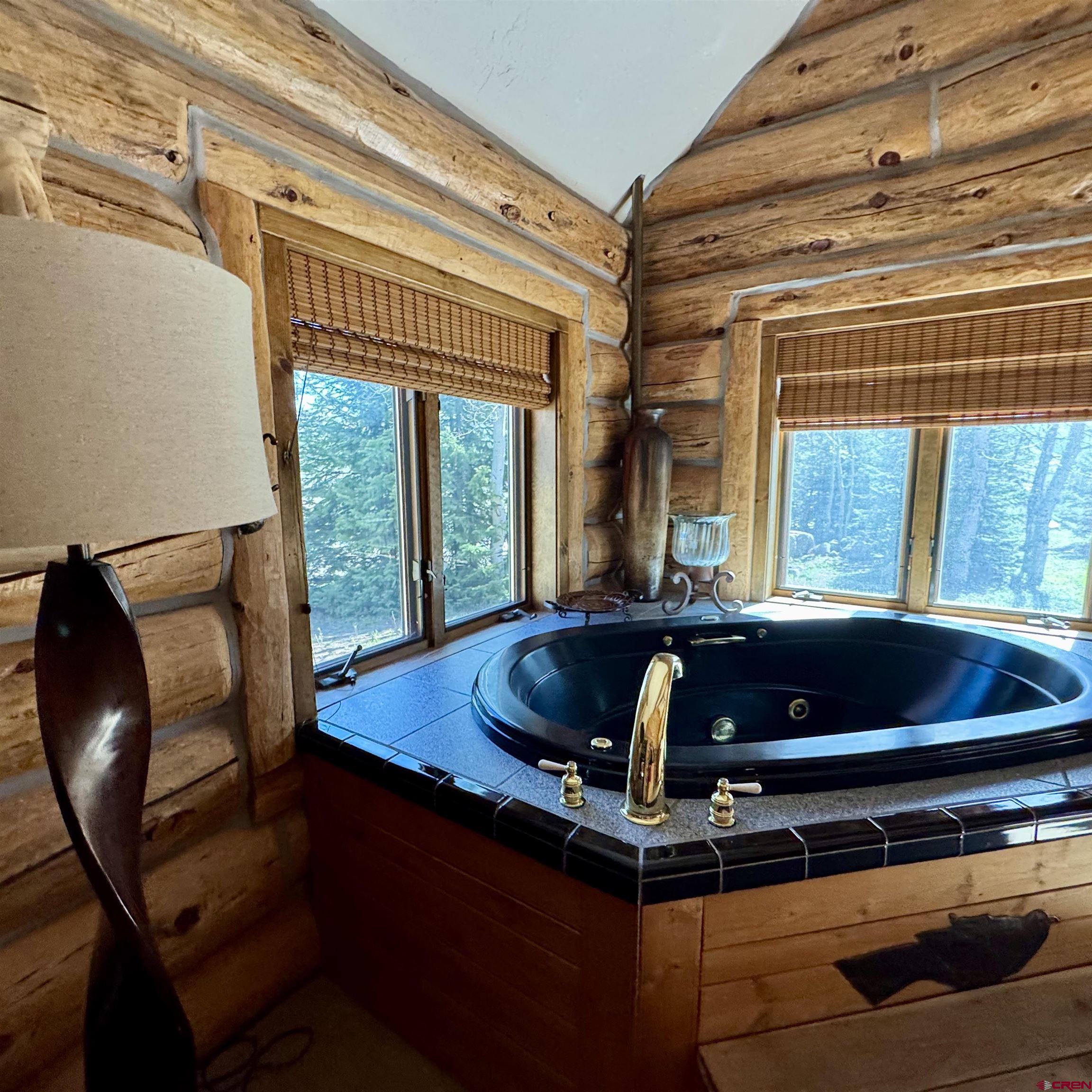 398 Journey's End Road Crested Butte, CO 81224 - Photo 33 of 42 a room with furniture and a large window