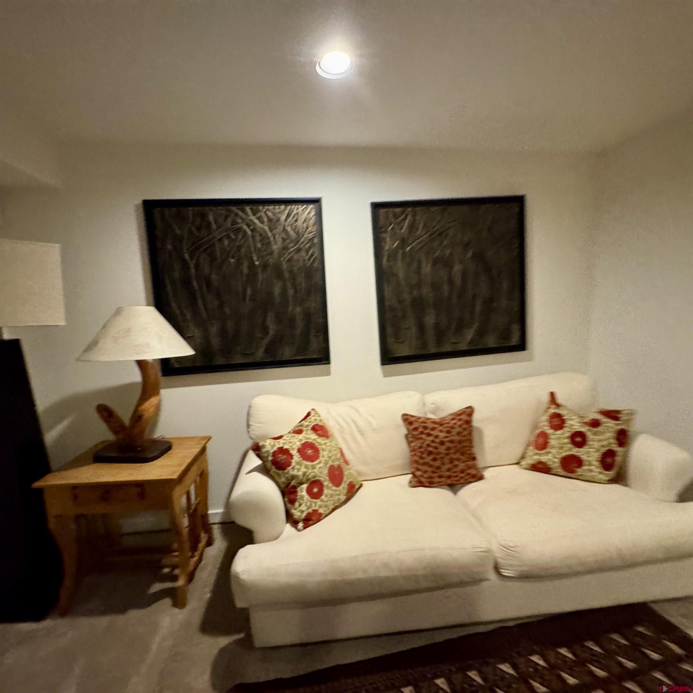 398 Journey's End Road Crested Butte, CO 81224 - Photo 34 of 42 a living room with furniture and a lamp