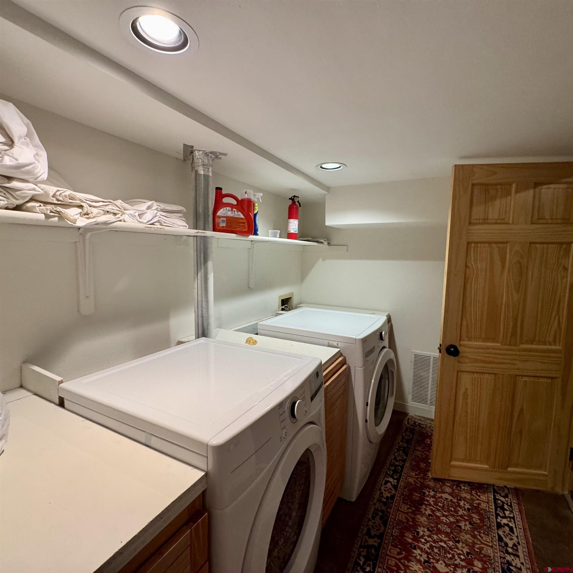 398 Journey's End Road Crested Butte, CO 81224 - Photo 35 of 42 a utility room with dryer and washer