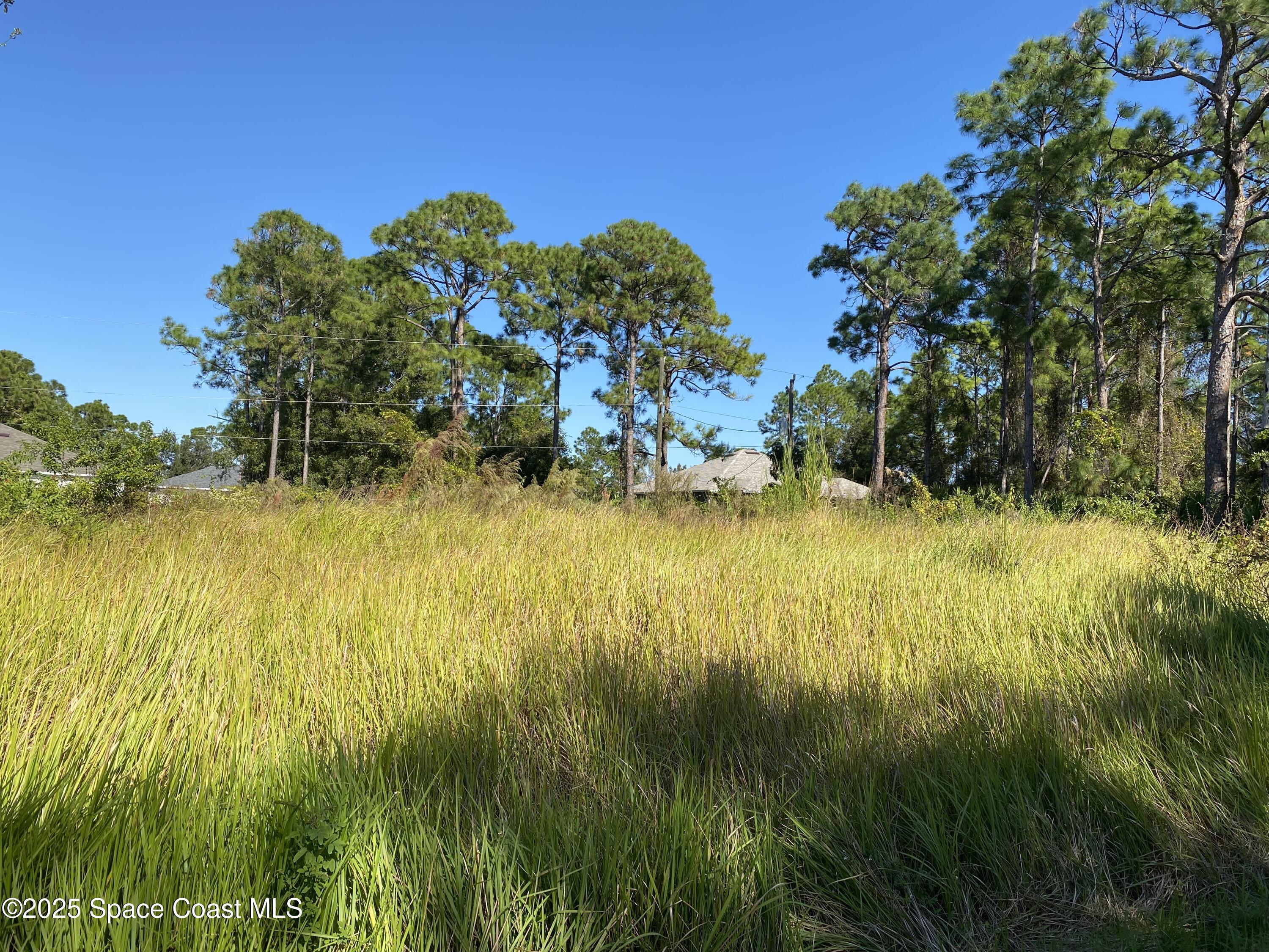 1121 Yager Road Southeast Palm Bay, FL 32909 - Photo 2 of 3 a view of lawn chairs and an ocean view