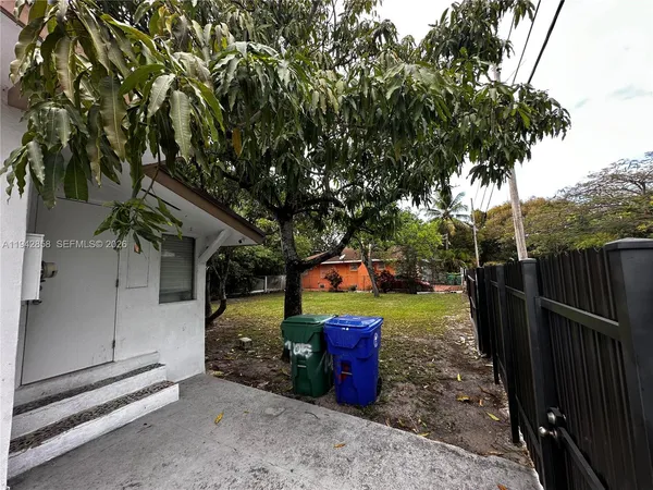 a view of a backyard with trees
