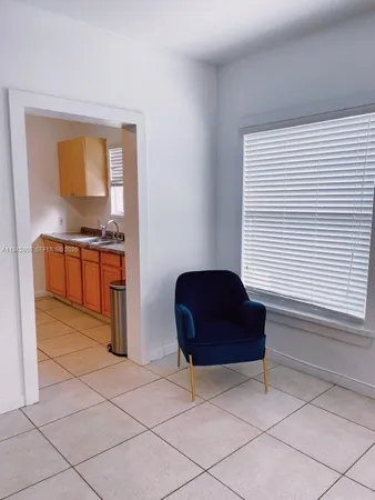 a living room with a couch and a chair