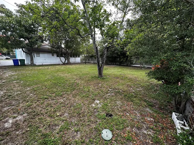a fire hydrant in the middle of a field
