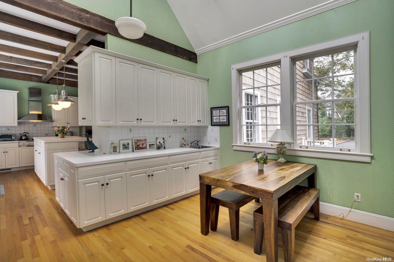 5 Shinnecock Road Quogue, NY 11959 - Photo 14 of 35 a kitchen with a sink cabinets and wooden floor