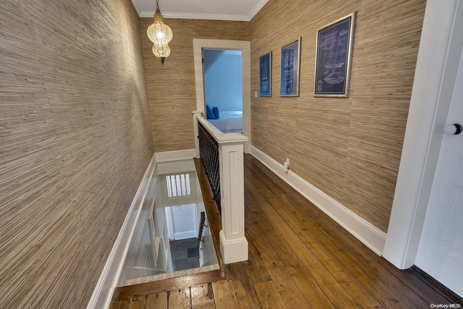 5 Shinnecock Road Quogue, NY 11959 - Photo 19 of 35 a view of balcony with wooden floor and stairs