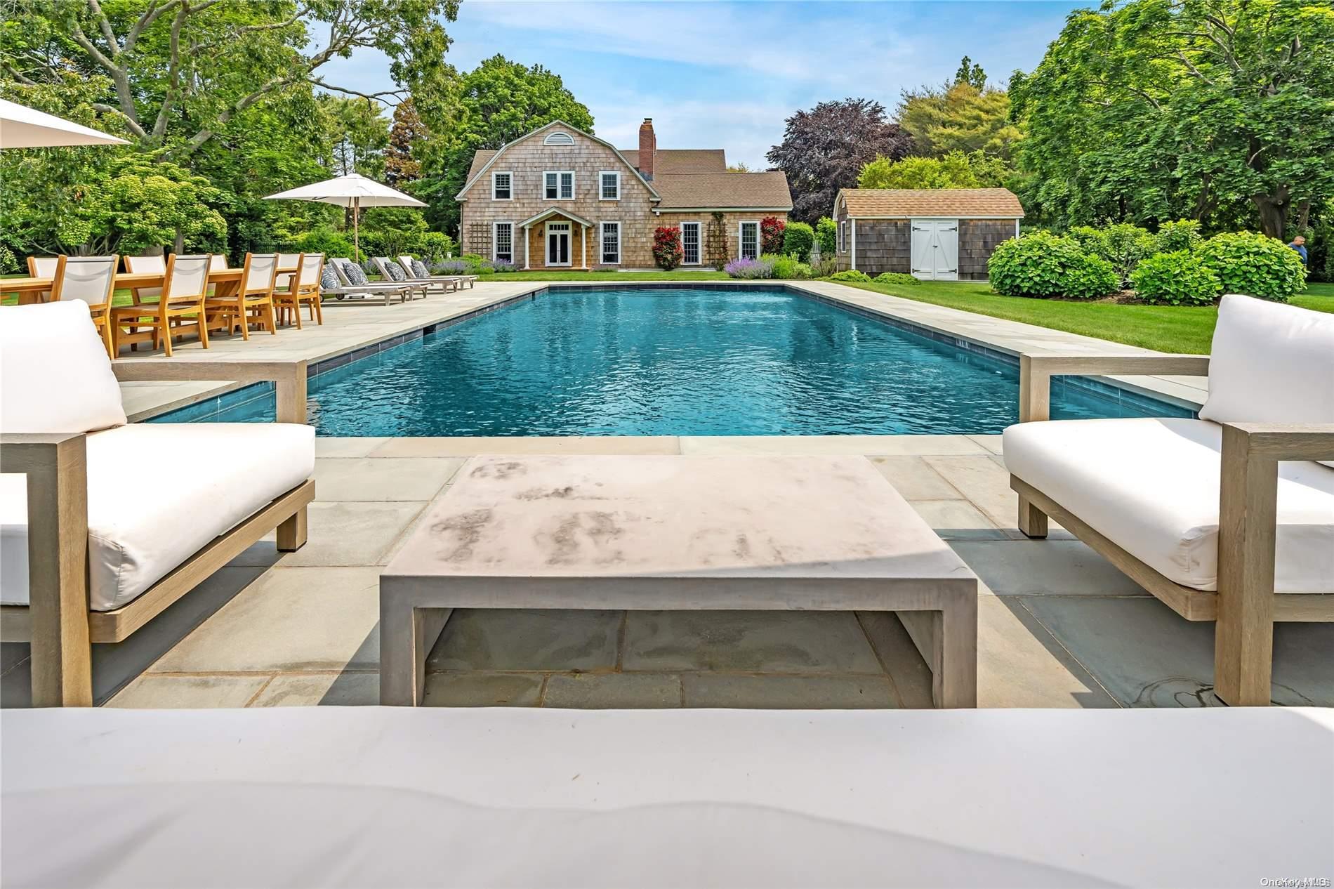 5 Shinnecock Road Quogue, NY 11959 - Photo 28 of 35 a aerial view of a house with swimming pool and sitting area