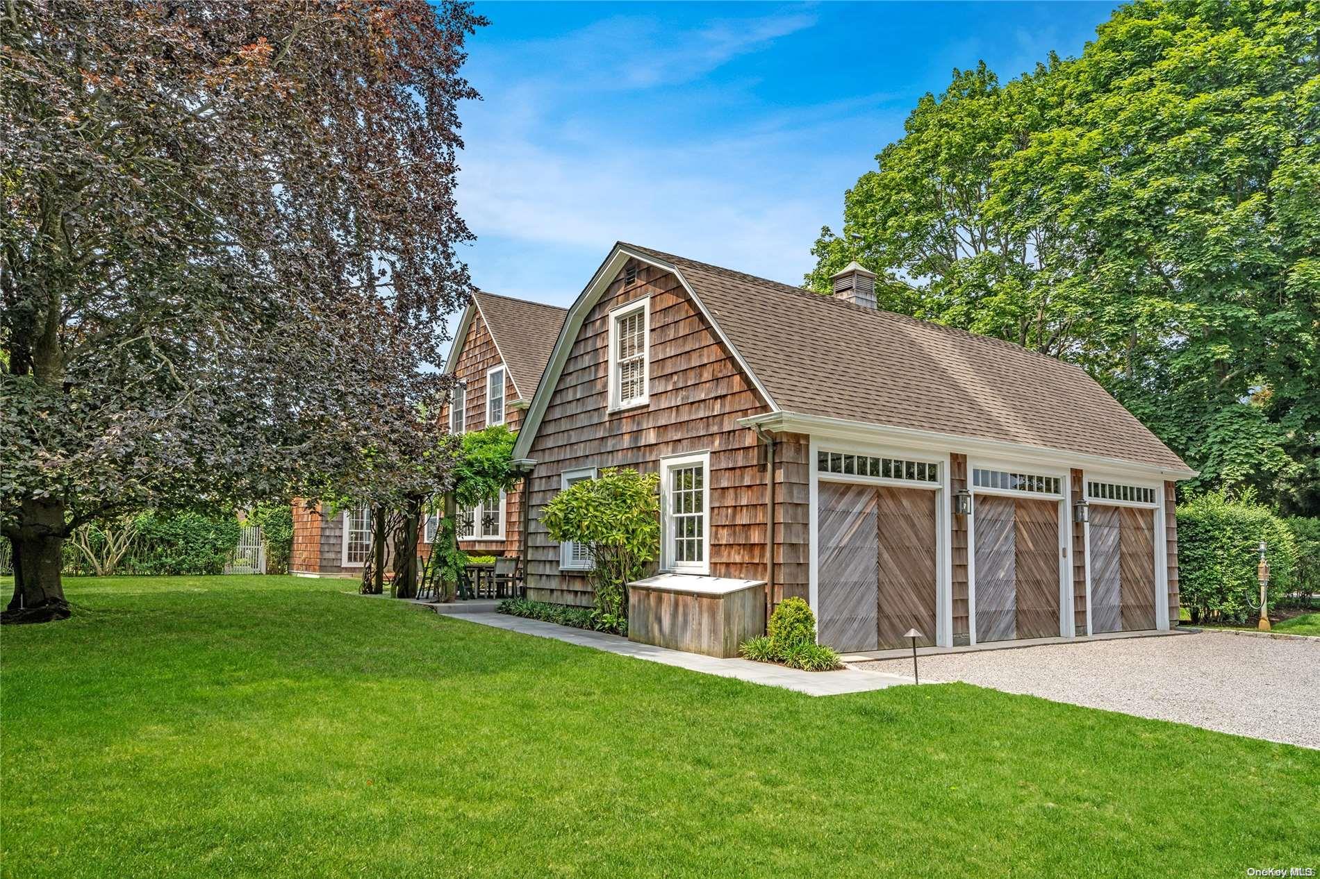 5 Shinnecock Road Quogue, NY 11959 - Photo 33 of 35 front view of a house with a yard