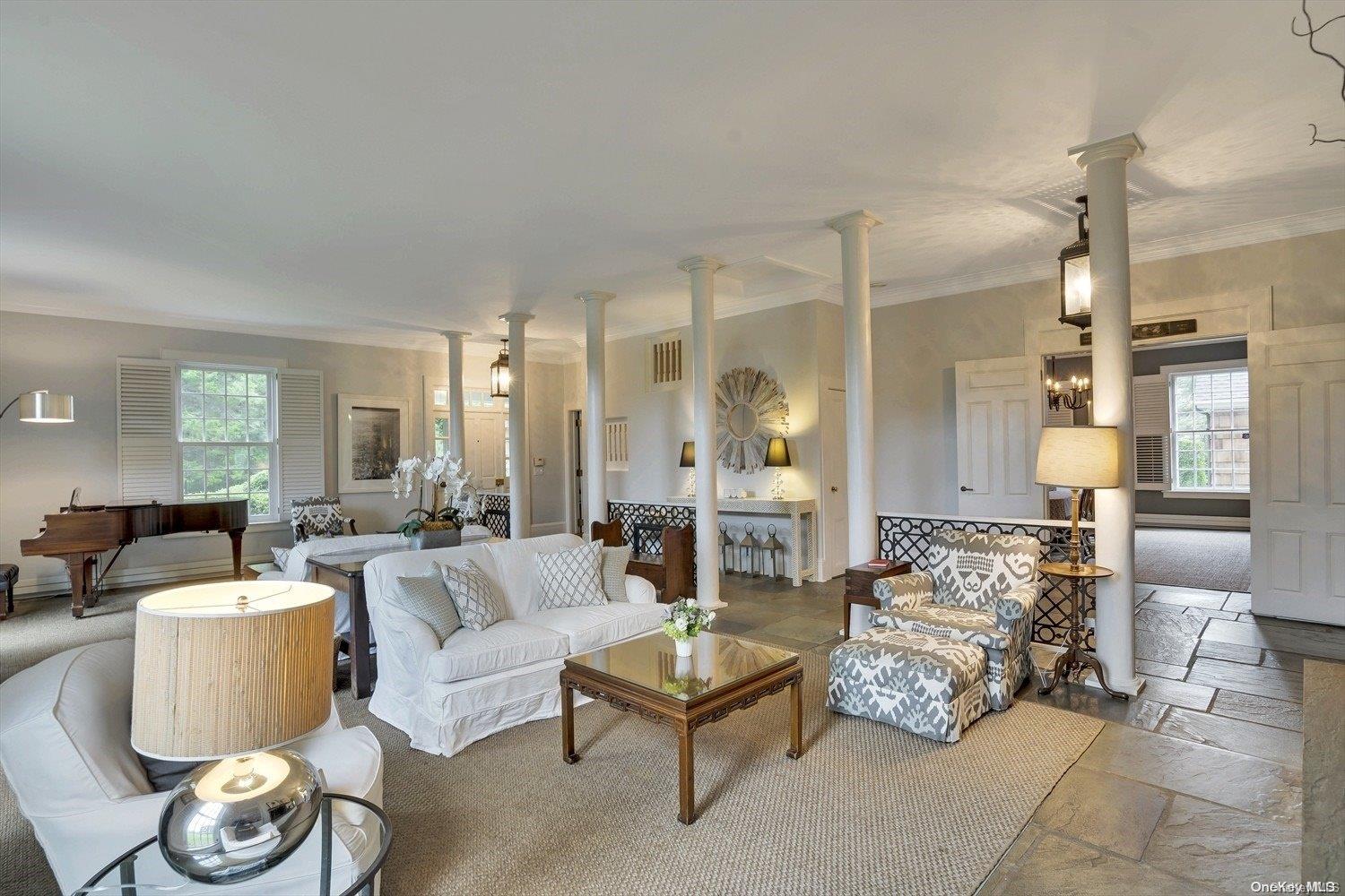 5 Shinnecock Road Quogue, NY 11959 - Photo 7 of 35 a living room with furniture and a large window
