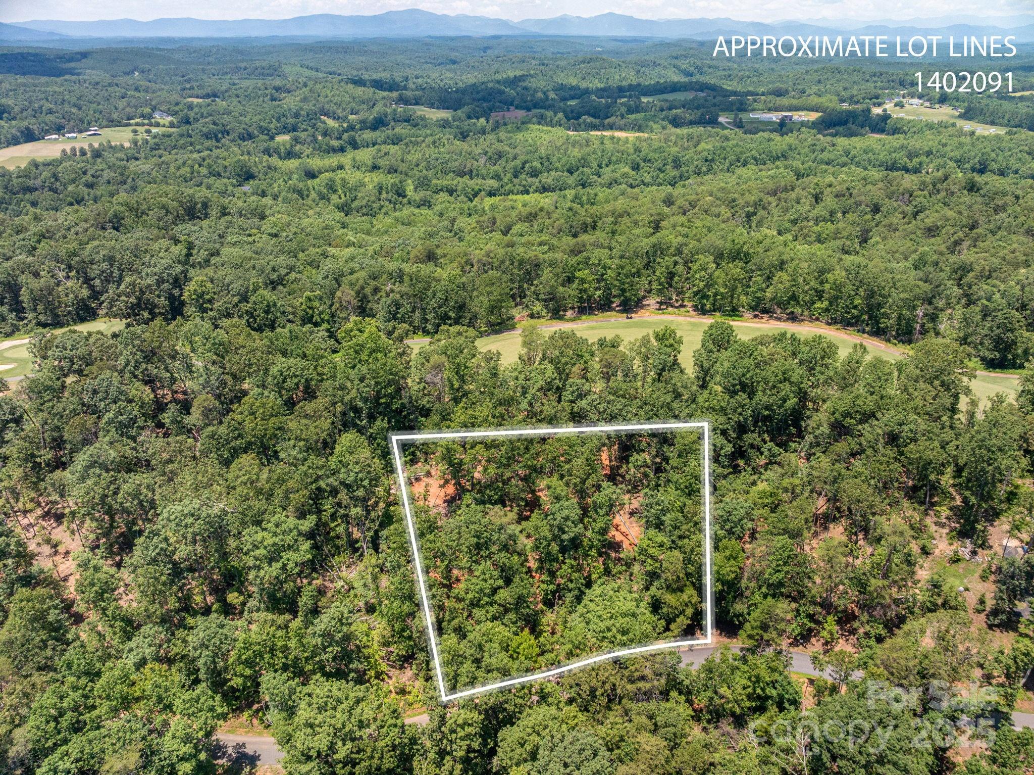 an aerial view of mountain with outdoor space