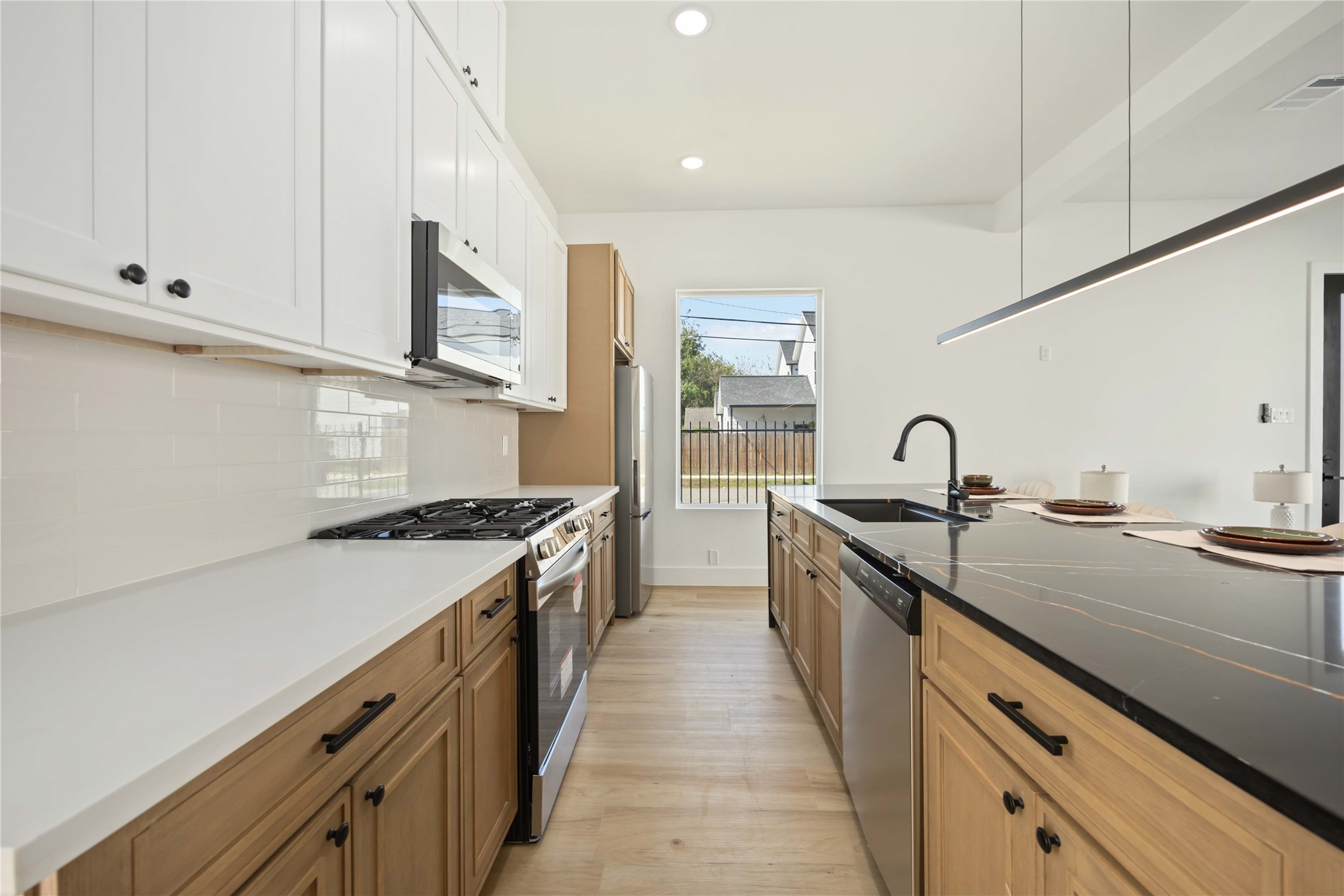 4202 Kewanee Street, Unit B Houston, TX 77051 - Photo 15 of 47 a large kitchen with stainless steel appliances granite countertop a lot of counter space and a sink
