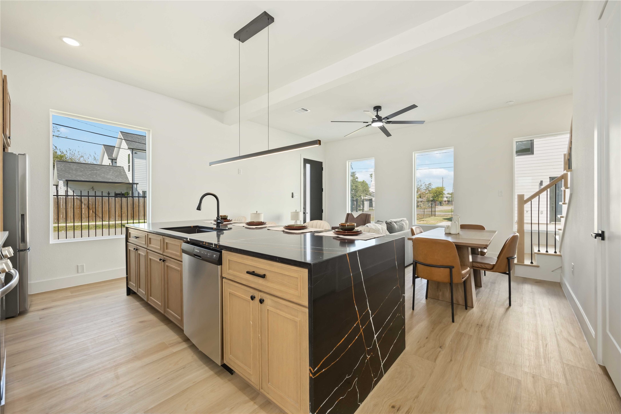 4202 Kewanee Street, Unit B Houston, TX 77051 - Photo 16 of 47 a kitchen with granite countertop a stove a sink a dining table and chairs
