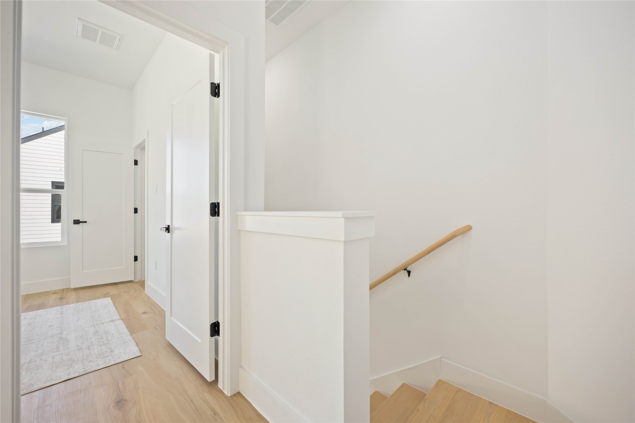 4202 Kewanee Street, Unit B Houston, TX 77051 - Photo 22 of 47 a view of a hallway with wooden floor and staircase