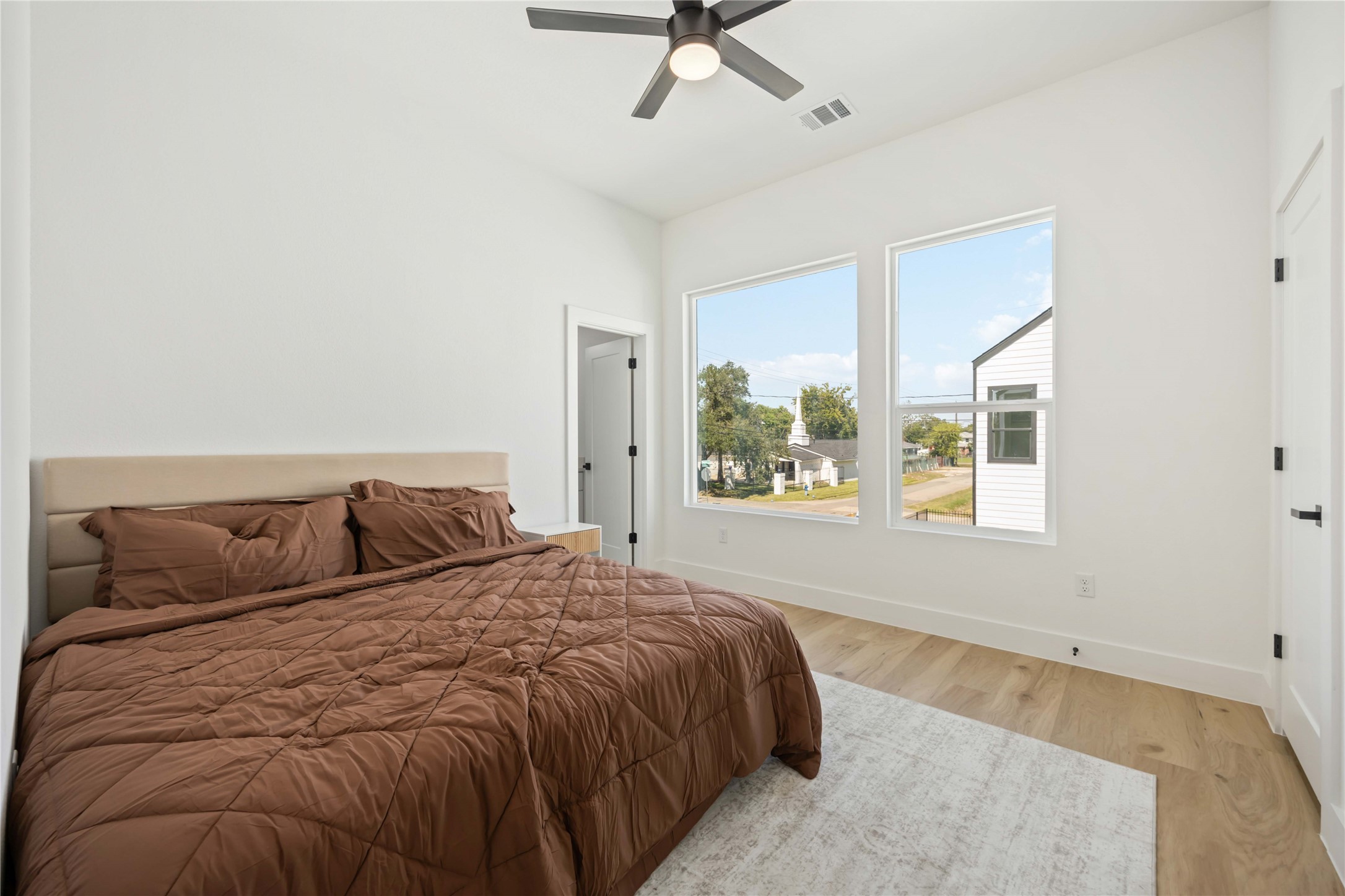 4202 Kewanee Street, Unit B Houston, TX 77051 - Photo 26 of 47 a bedroom with a large bed and a large window