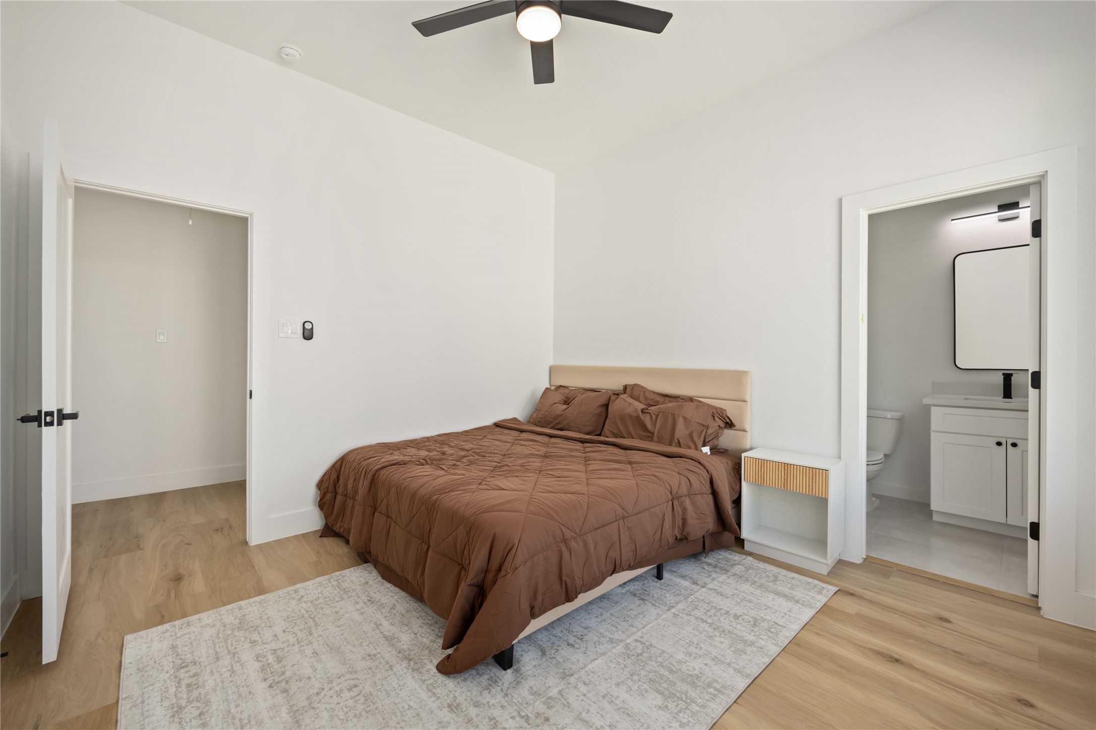 4202 Kewanee Street, Unit B Houston, TX 77051 - Photo 27 of 47 a bedroom with a bed and a chandelier