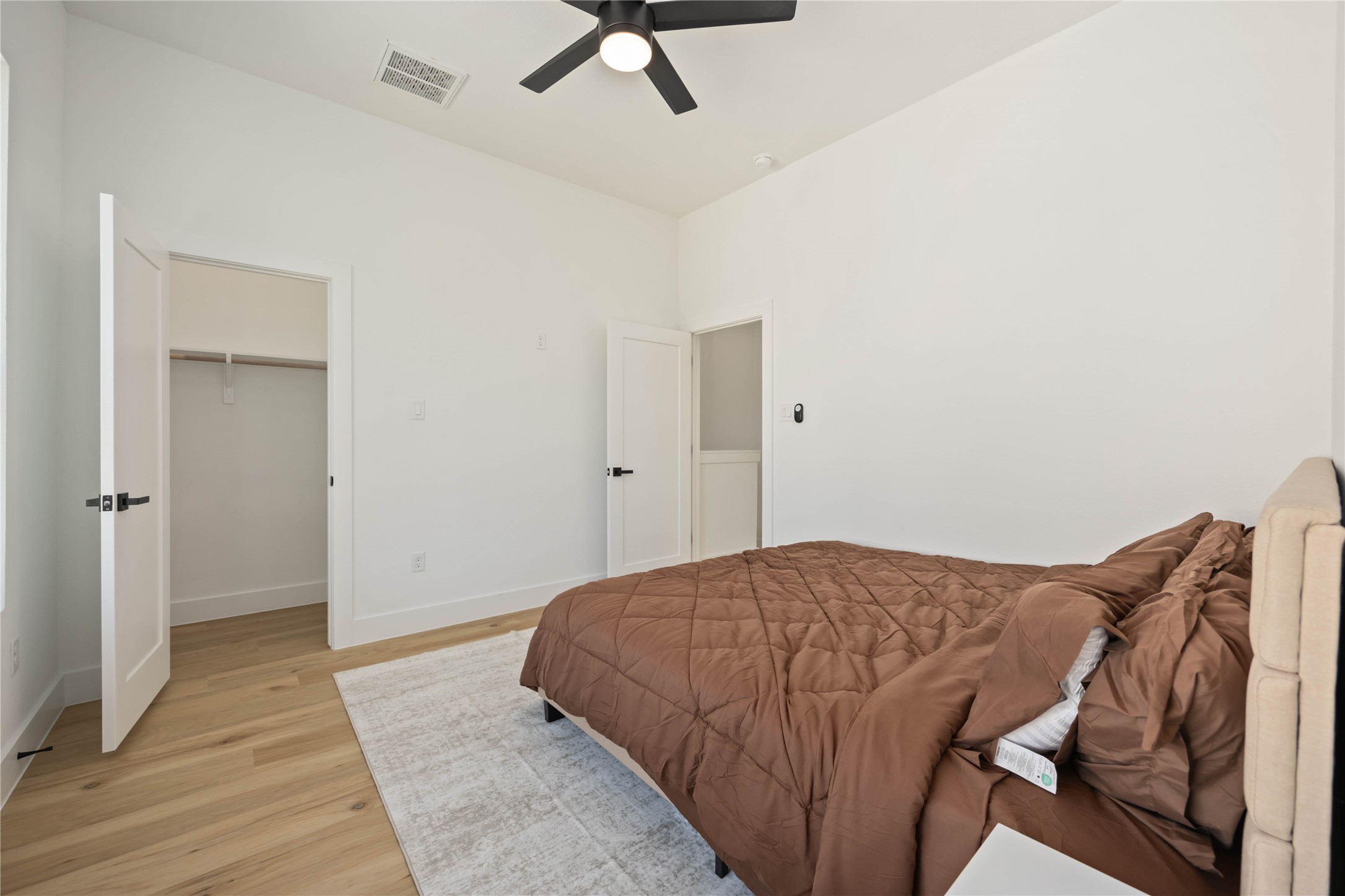 4202 Kewanee Street, Unit B Houston, TX 77051 - Photo 28 of 47 a bedroom with a bed and cabinets