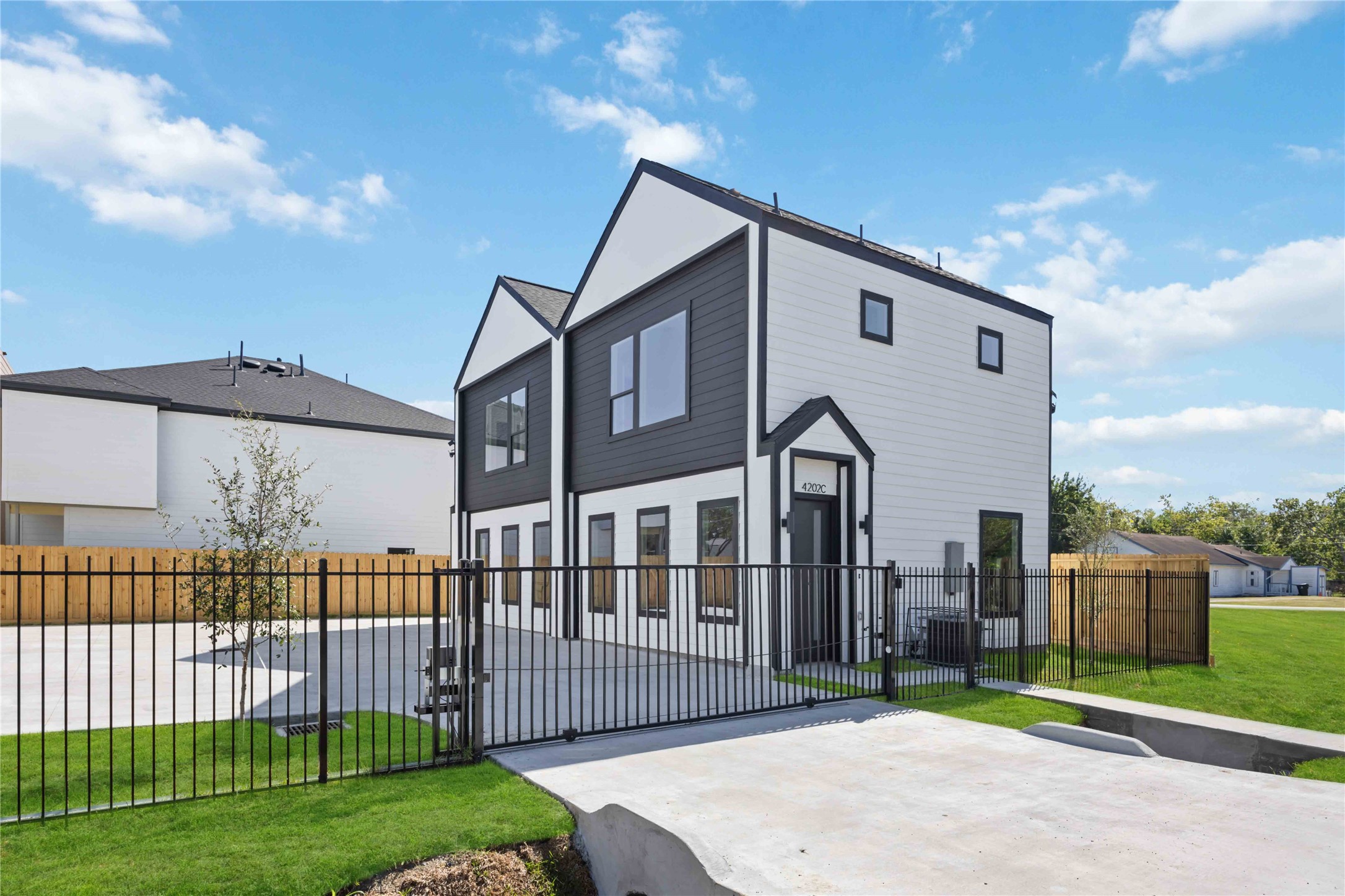 4202 Kewanee Street, Unit B Houston, TX 77051 - Photo 4 of 47 a front view of a house with a garden and plants