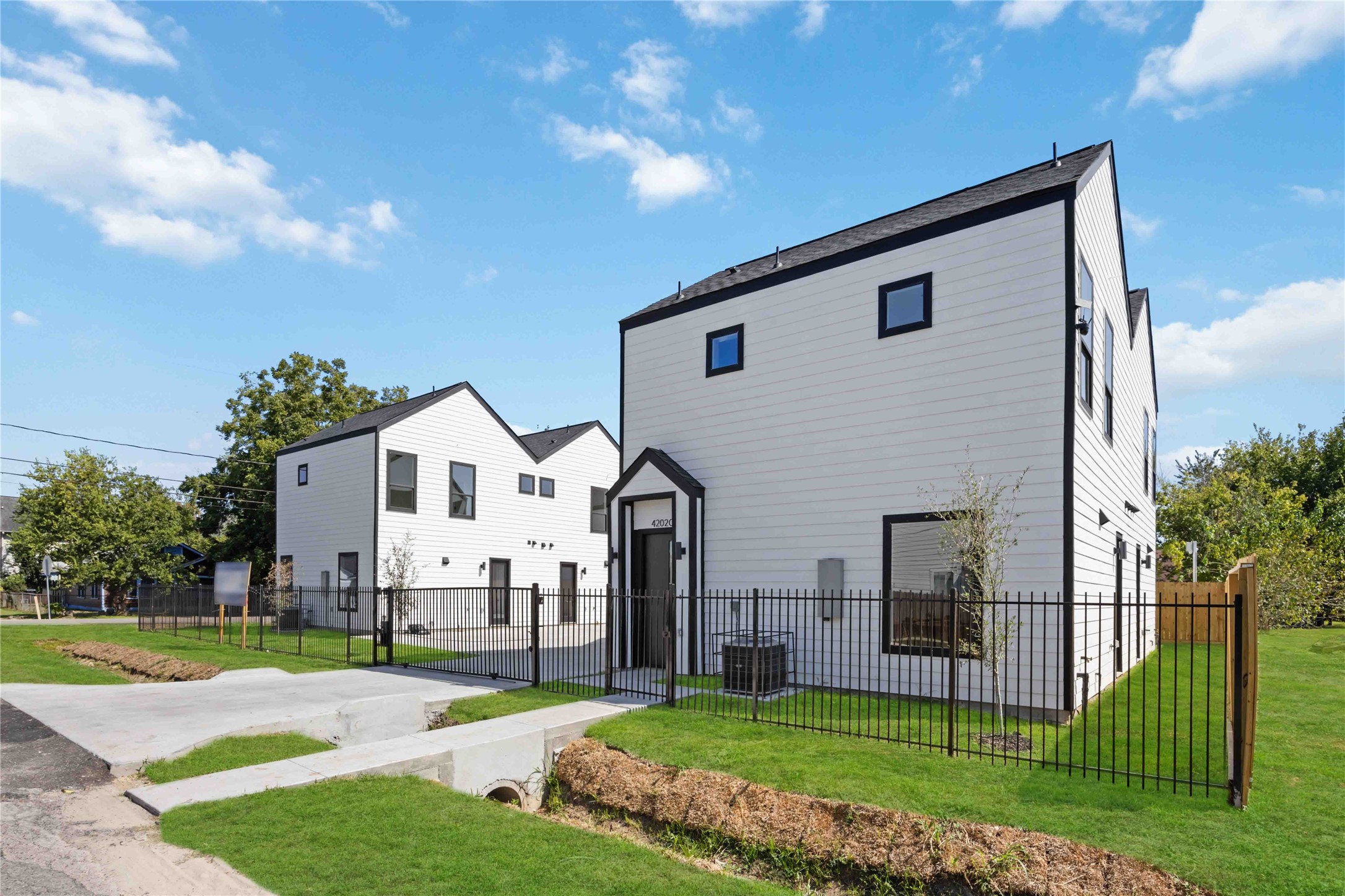 4202 Kewanee Street, Unit B Houston, TX 77051 - Photo 6 of 47 a front view of a house with a yard and garage
