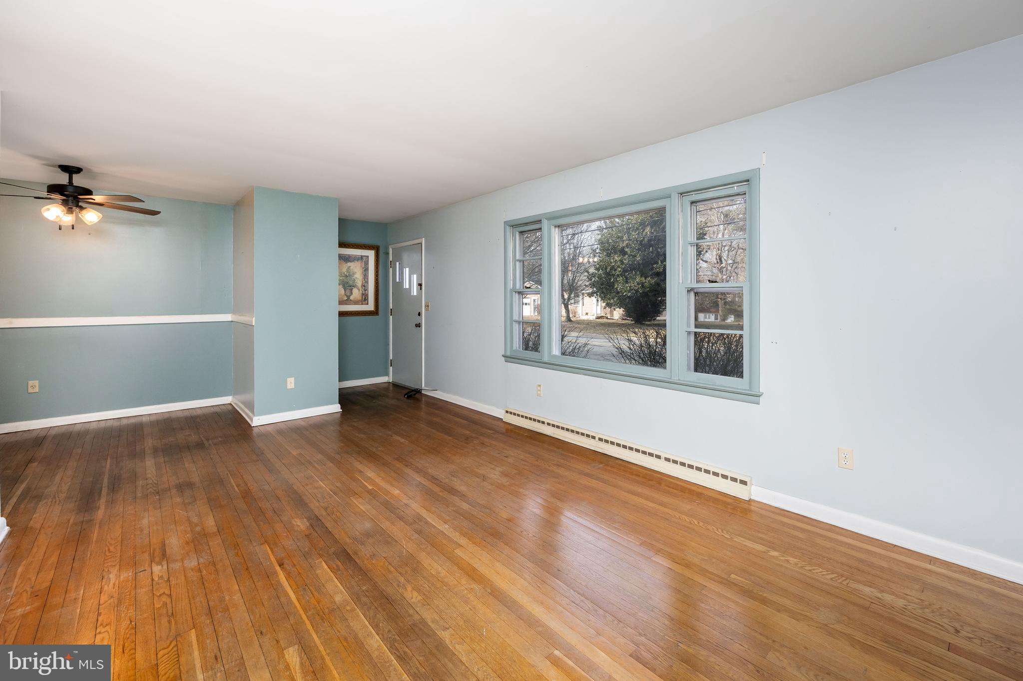 310 Zion Road Salisbury, MD 21804 - Photo 10 of 40 a view of empty room with wooden floor and fan