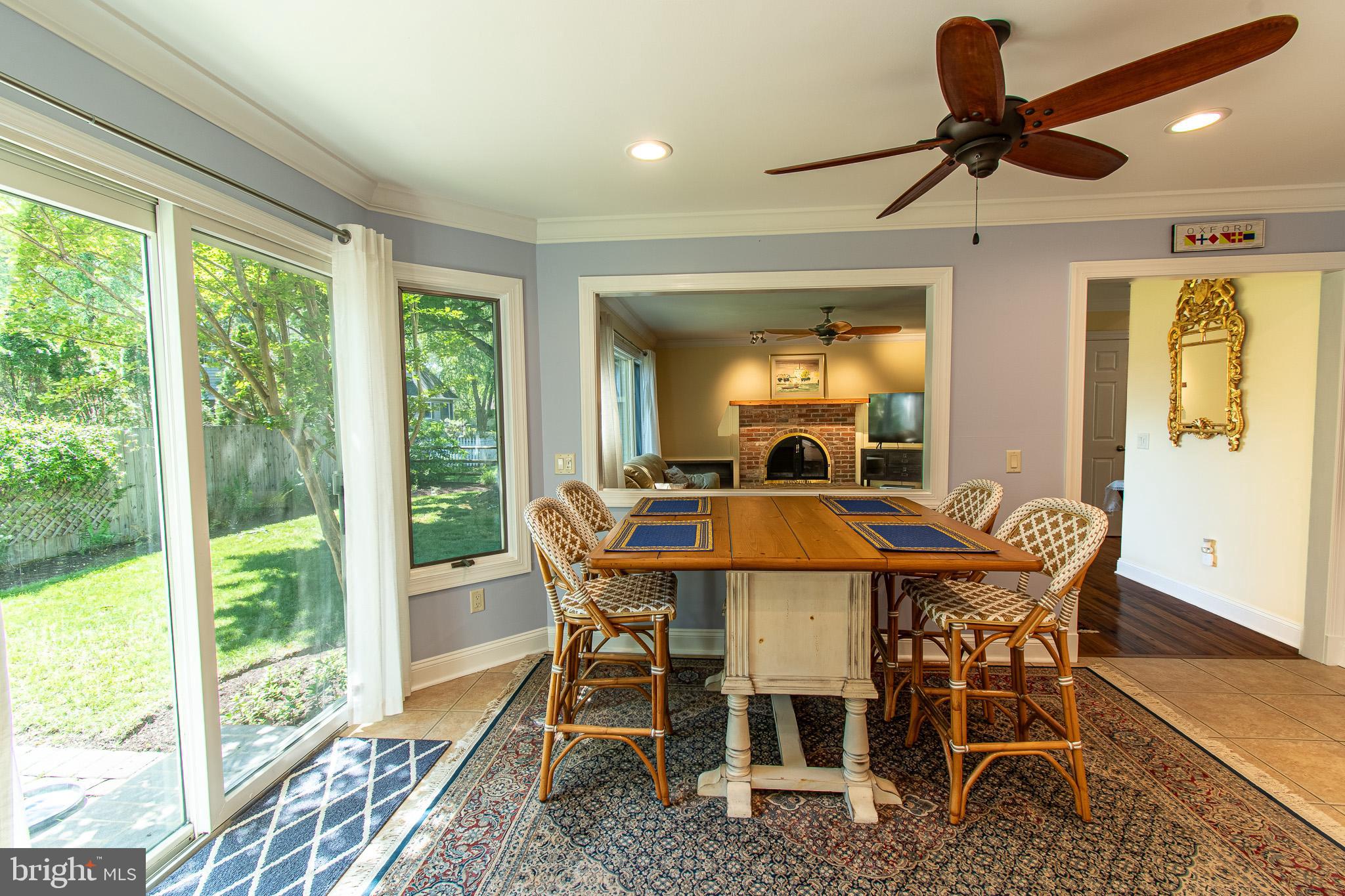102 Jacks Point Road Oxford, MD 21654 - Photo 18 of 83 a dining room with furniture a chandelier and wooden floor
