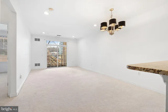 an empty room with a windows